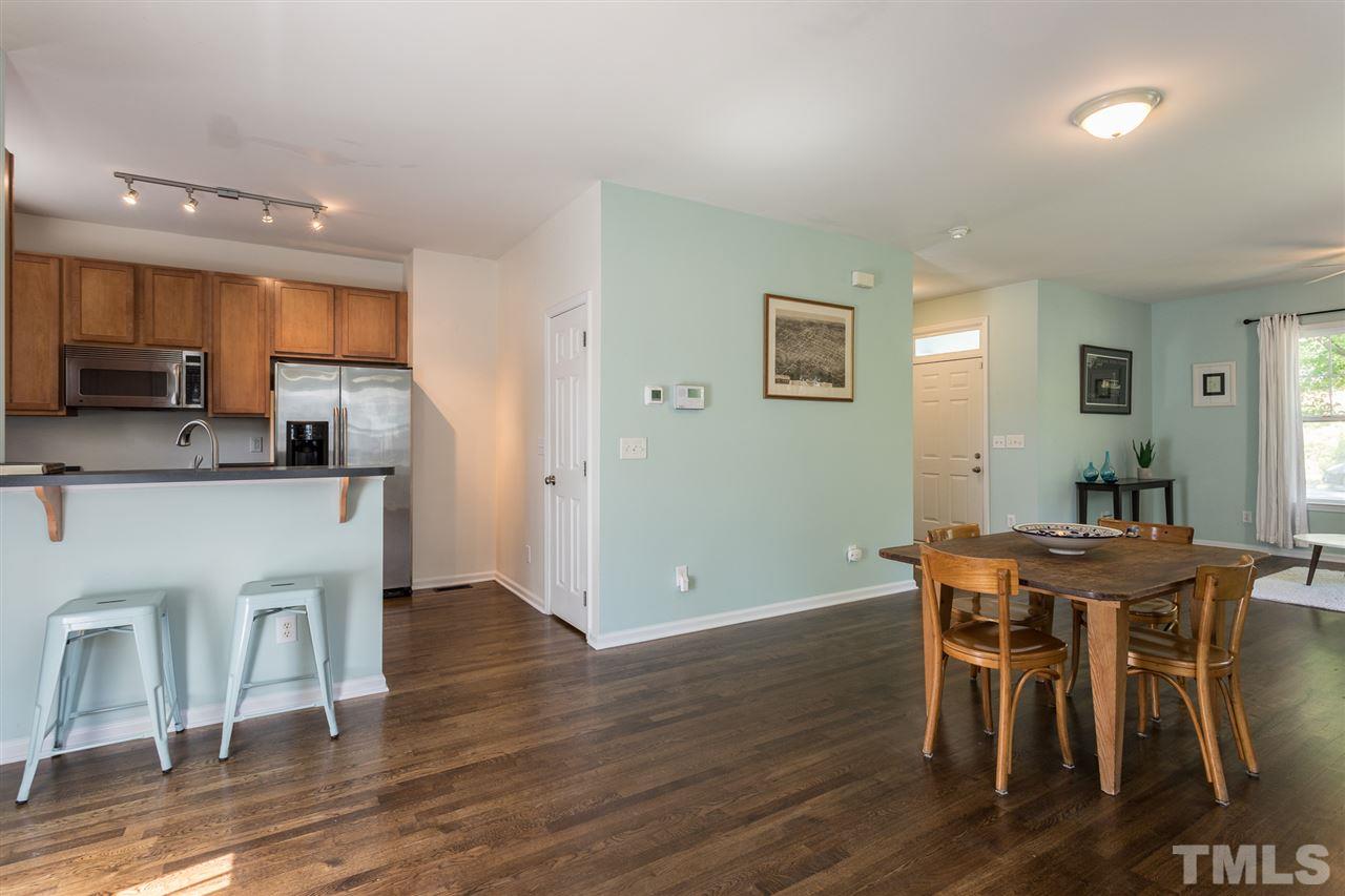 233 Cooke Street Raleigh, NC 27601 - Photo 6 of 27 Kitchen includes open concept with breakfast bar and a pantry as well