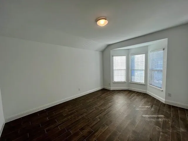a view of kitchen with sink microwave and refrigerator
