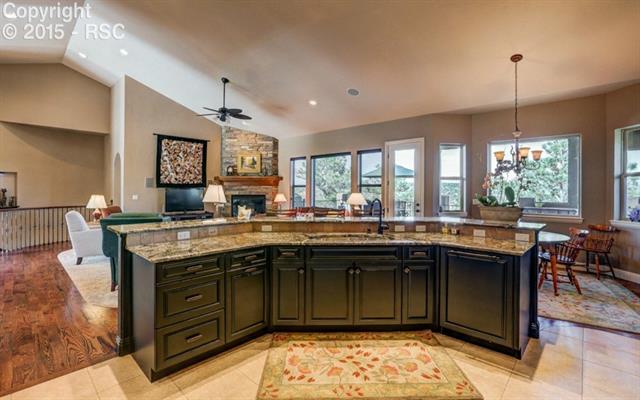 4875 Seton Hall Road Colorado Springs, CO 80918 - Photo 13 of 33 Large Kitchen Bar Open to Great Room