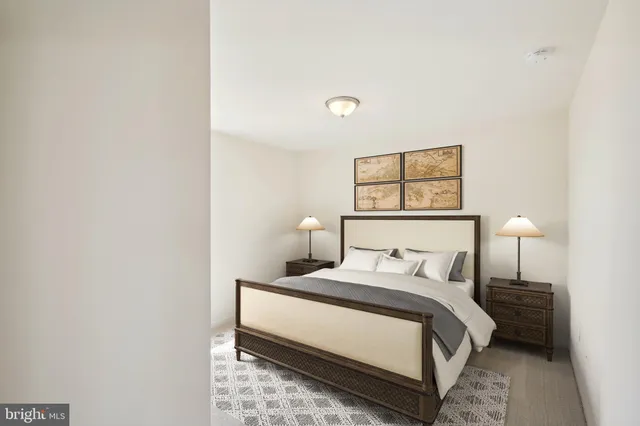 a bedroom with a bed and a night lamp