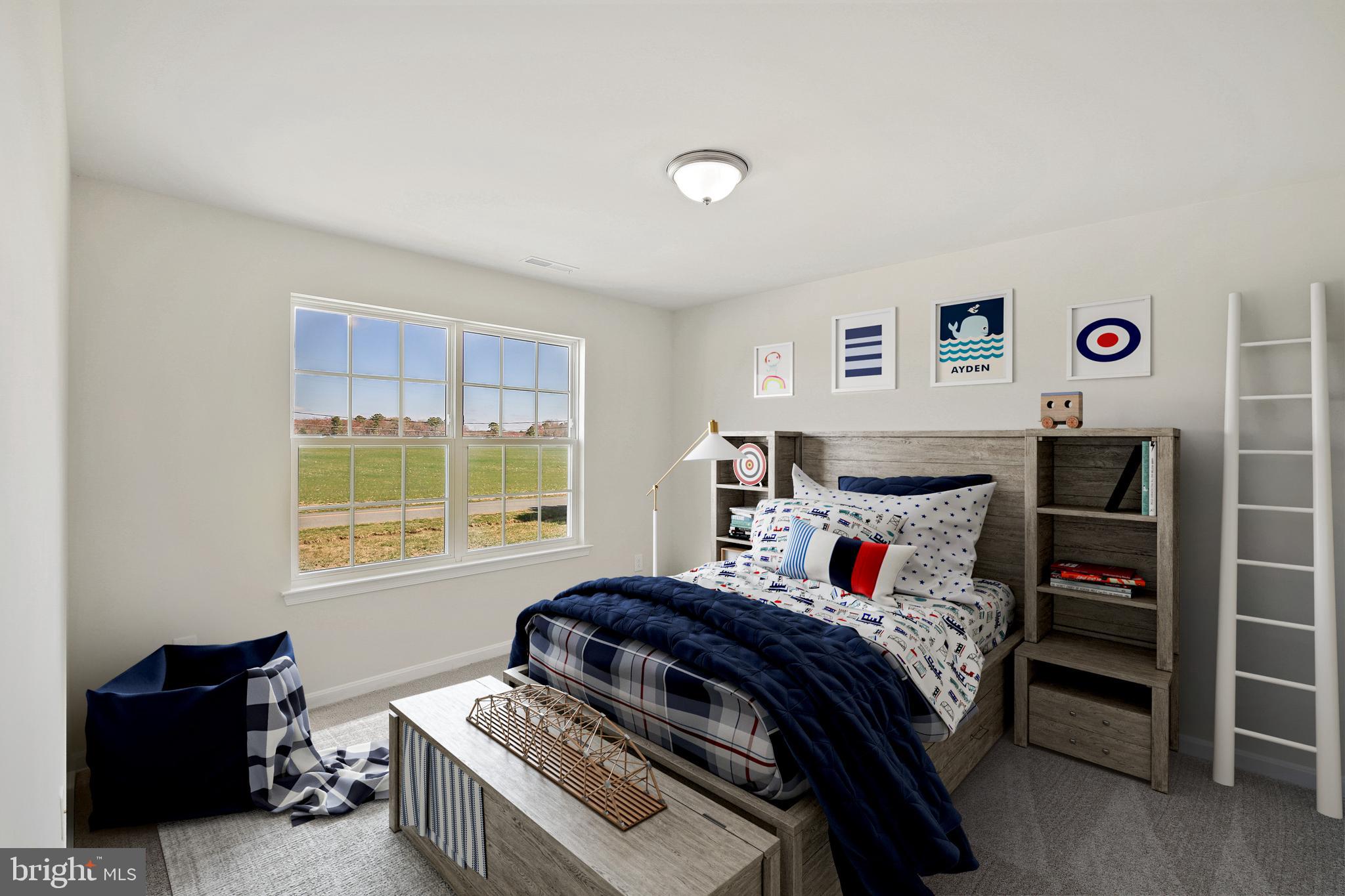 26553 Line Road Seaford, DE 19973 - Photo 18 of 22 a bedroom with a bed and a window