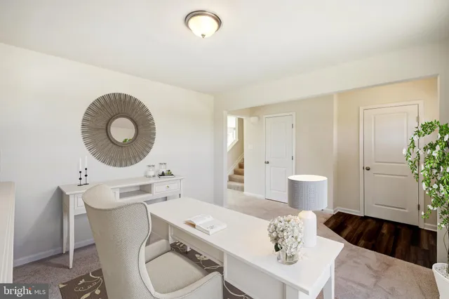 a living room with furniture and a chair