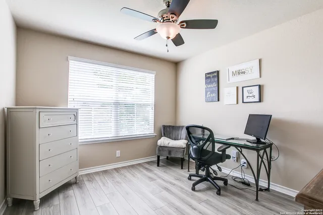 a workspace with furniture and a window