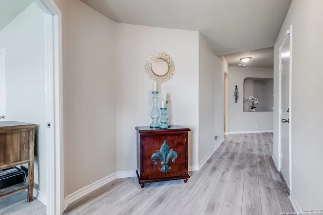 a view of an entryway with wooden floor