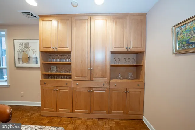 a kitchen with stainless steel appliances a sink and cabinets