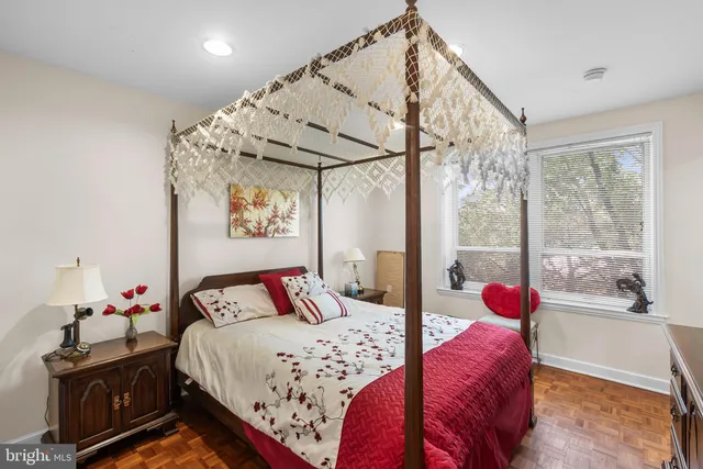 a bathroom with a shower sink vanity and toilet
