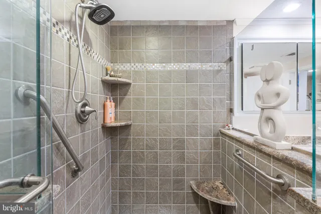 a view of walk in closet with clothes