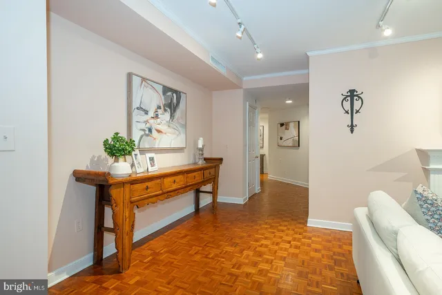 a sign that is sitting in front of flowers