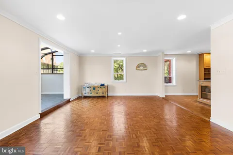 a view of a dining room with furniture and a potted plant