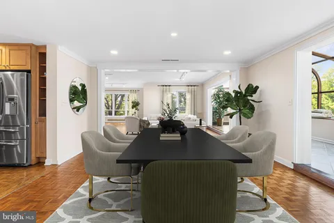 a living room with furniture wooden floor and a table