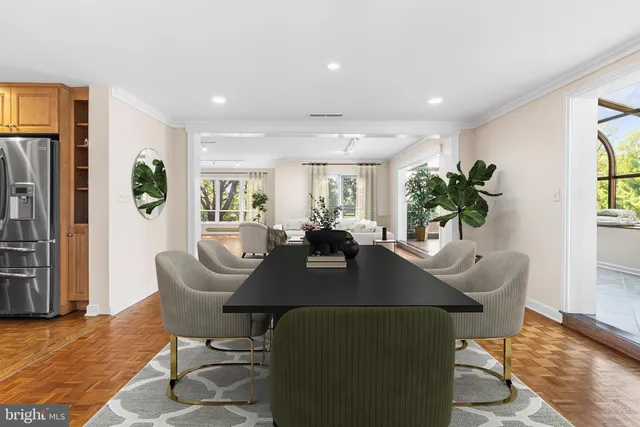 a living room with furniture wooden floor and a table