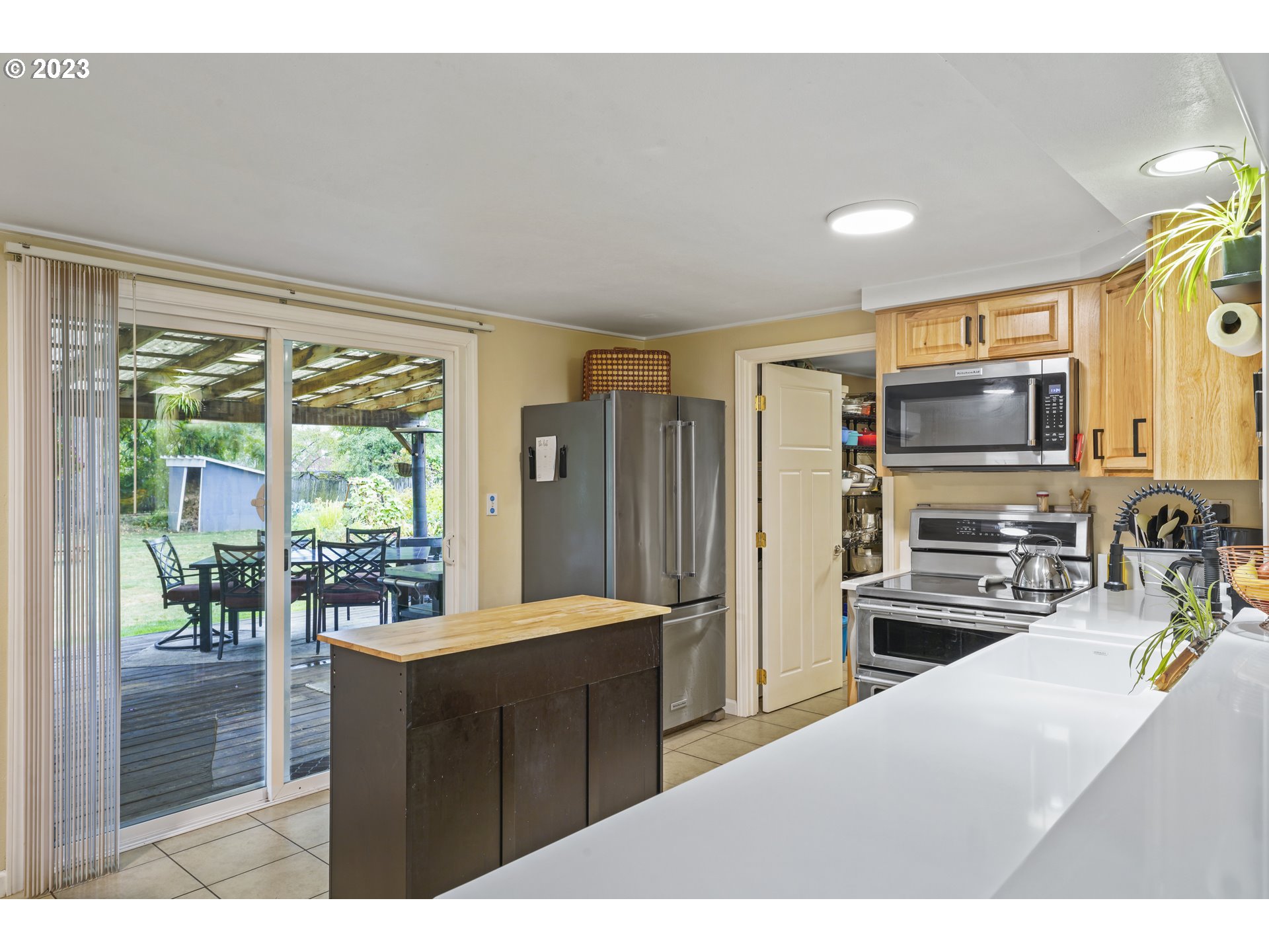 180 S Street Springfield, OR 97477 - Photo 8 of 35 a kitchen with stainless steel appliances a refrigerator and a sink