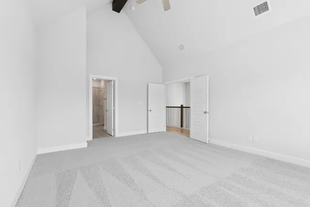 a view of an empty room with a closet