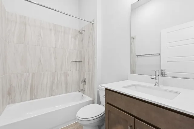 a bathroom with a sink a toilet and a bathtub