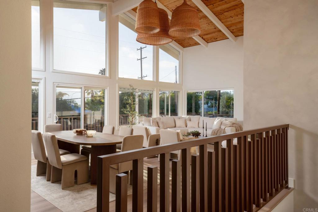 1551 Burgundy Road Encinitas, CA 92024 - Photo 3 of 45 a dining room with furniture a chandelier and wooden floor