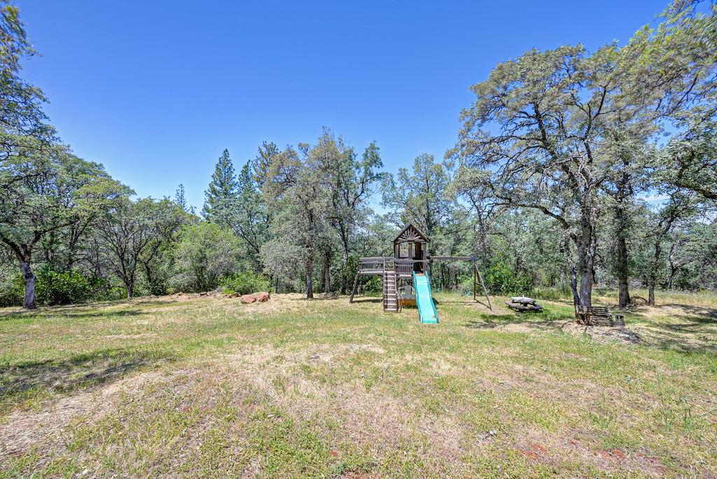3154 Twin K Road Pilot Hill, CA 95664 - Photo 10 of 89 a backyard of a house with a yard and entertaining space
