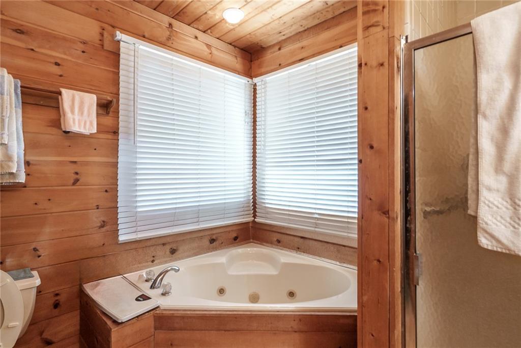 1840 Double Springs Church Road Monroe, GA 30656 - Photo 24 of 73 a bathroom with a bathtub and shower