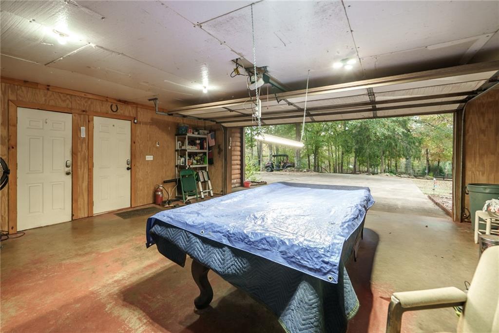1840 Double Springs Church Road Monroe, GA 30656 - Photo 40 of 73 a dining room with a wooden table and chairs