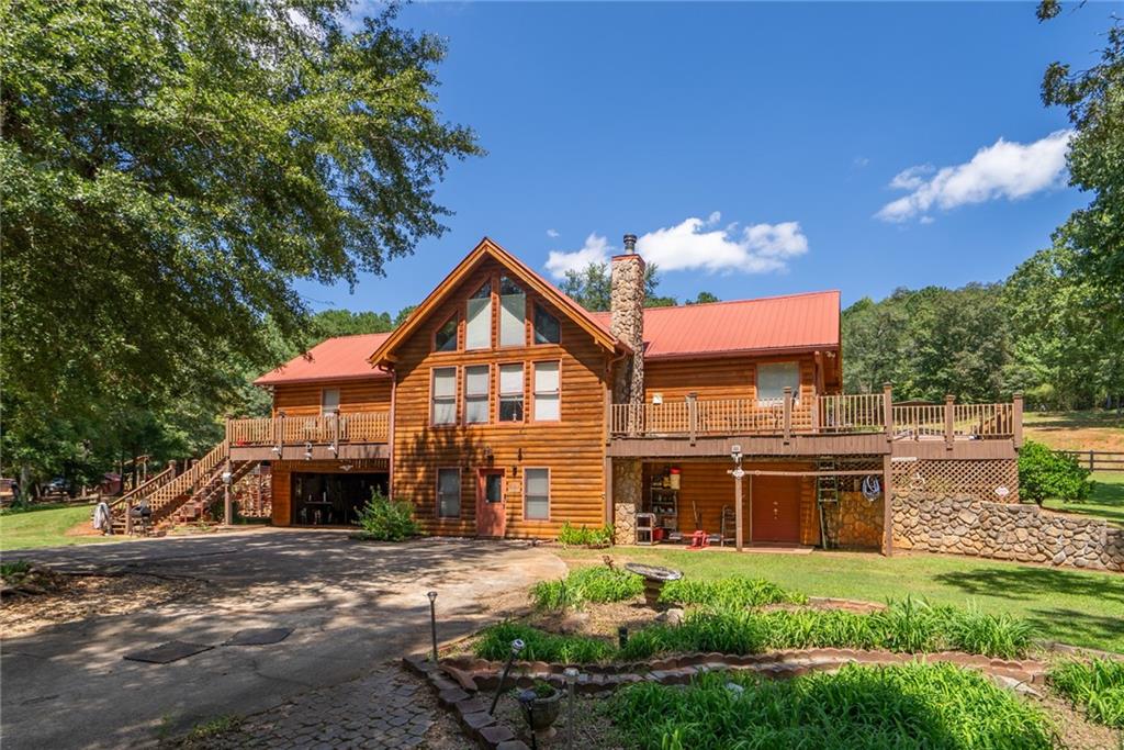 1840 Double Springs Church Road Monroe, GA 30656 - Photo 6 of 73 a front view of a house with yard