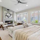 a living room with furniture fireplace and flat screen tv