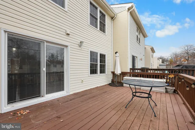 a view of balcony with seating space and wooden floor
