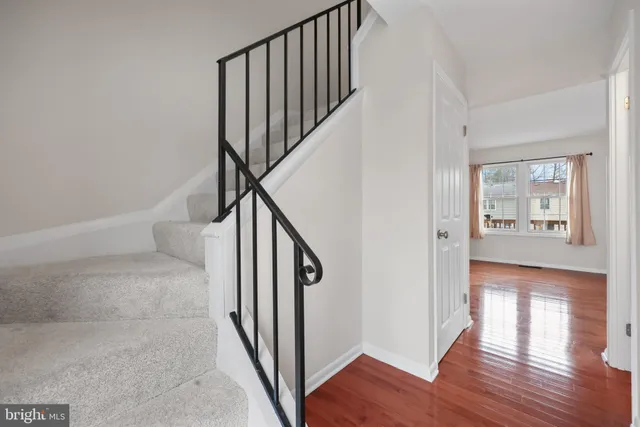 a view of an entryway with wooden floor