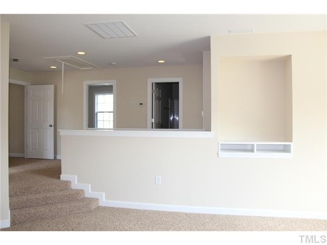 2804 Bending Tree Court Raleigh, NC 27613 - Photo 14 of 25 Step Down Entry, Frieze Carpet, Built In Entertainment Niche! Bonus Room