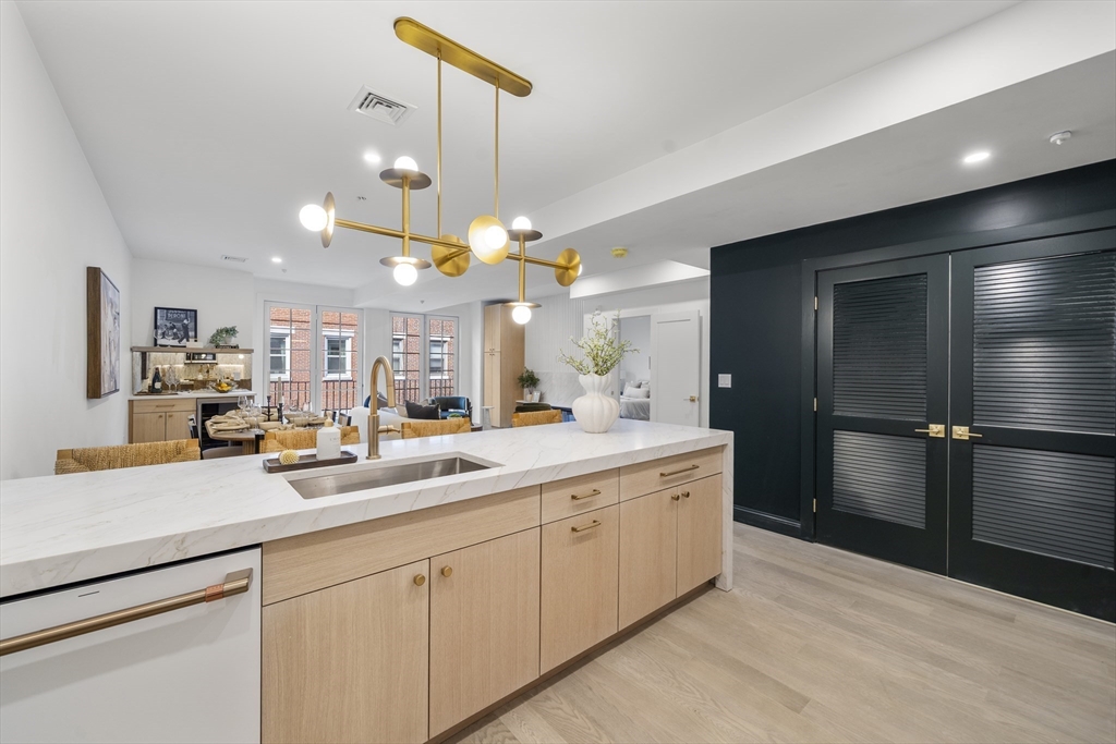 51 North Margin Street, Unit 3 Boston, MA 02113 - Photo 3 of 19 a kitchen with a sink and refrigerator