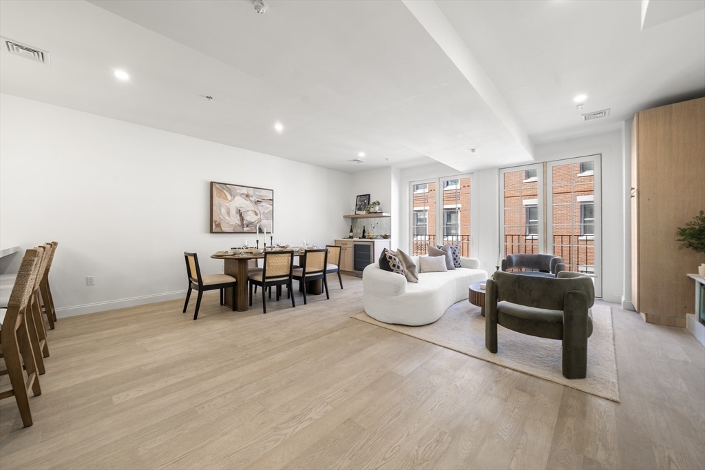 51 North Margin Street, Unit 3 Boston, MA 02113 - Photo 8 of 19 a living room with furniture and a large window