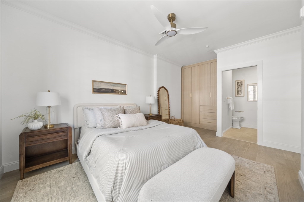 51 North Margin Street, Unit 3 Boston, MA 02113 - Photo 10 of 19 a bedroom with a bed and a chandelier