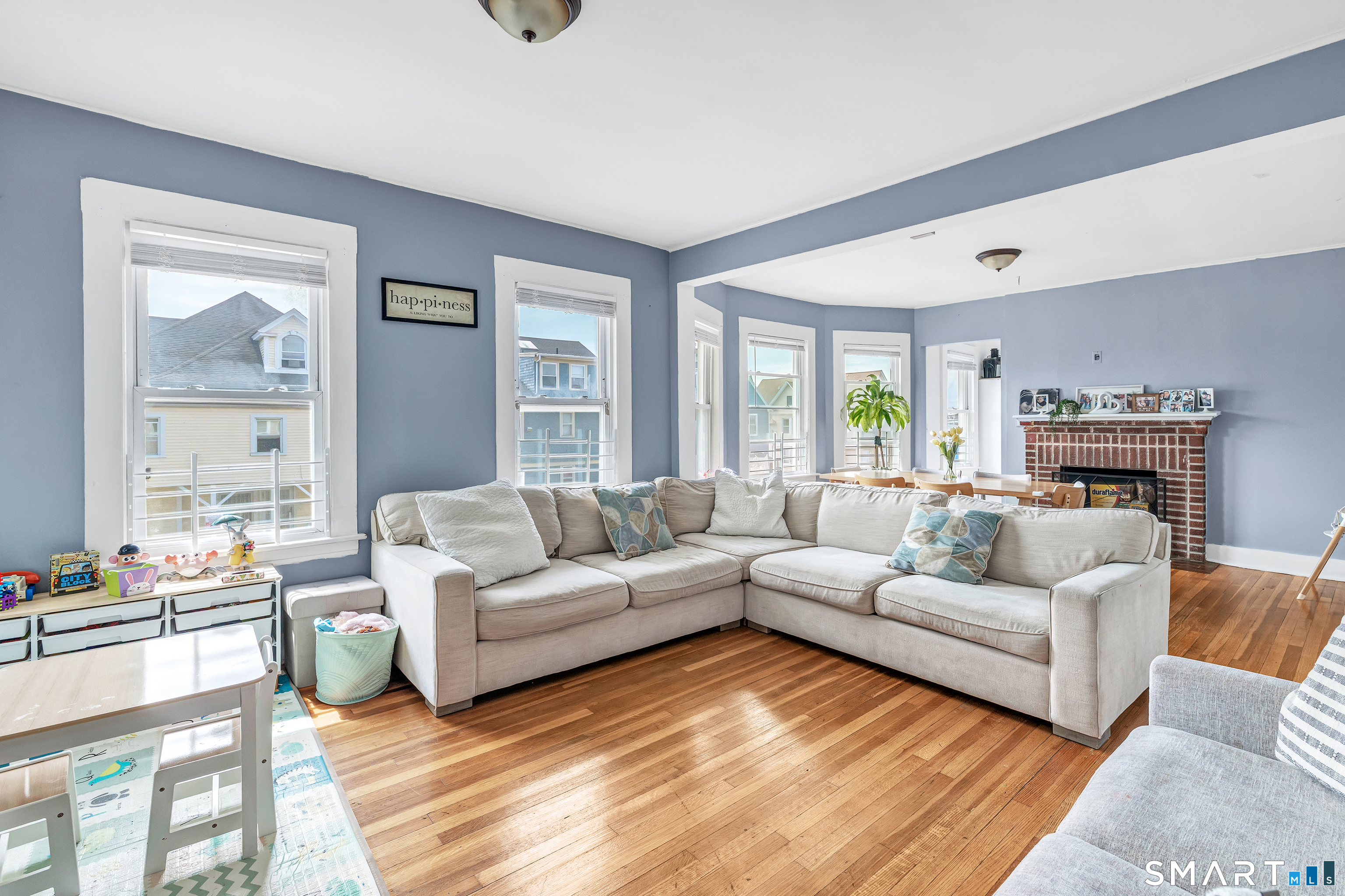 189 Wells Street Bridgeport, CT 06606 - Photo 10 of 40 2nd Floor - Offers 1389 sq ft -Shared LR & DR has operable wood burning fireplace, hardwood floors