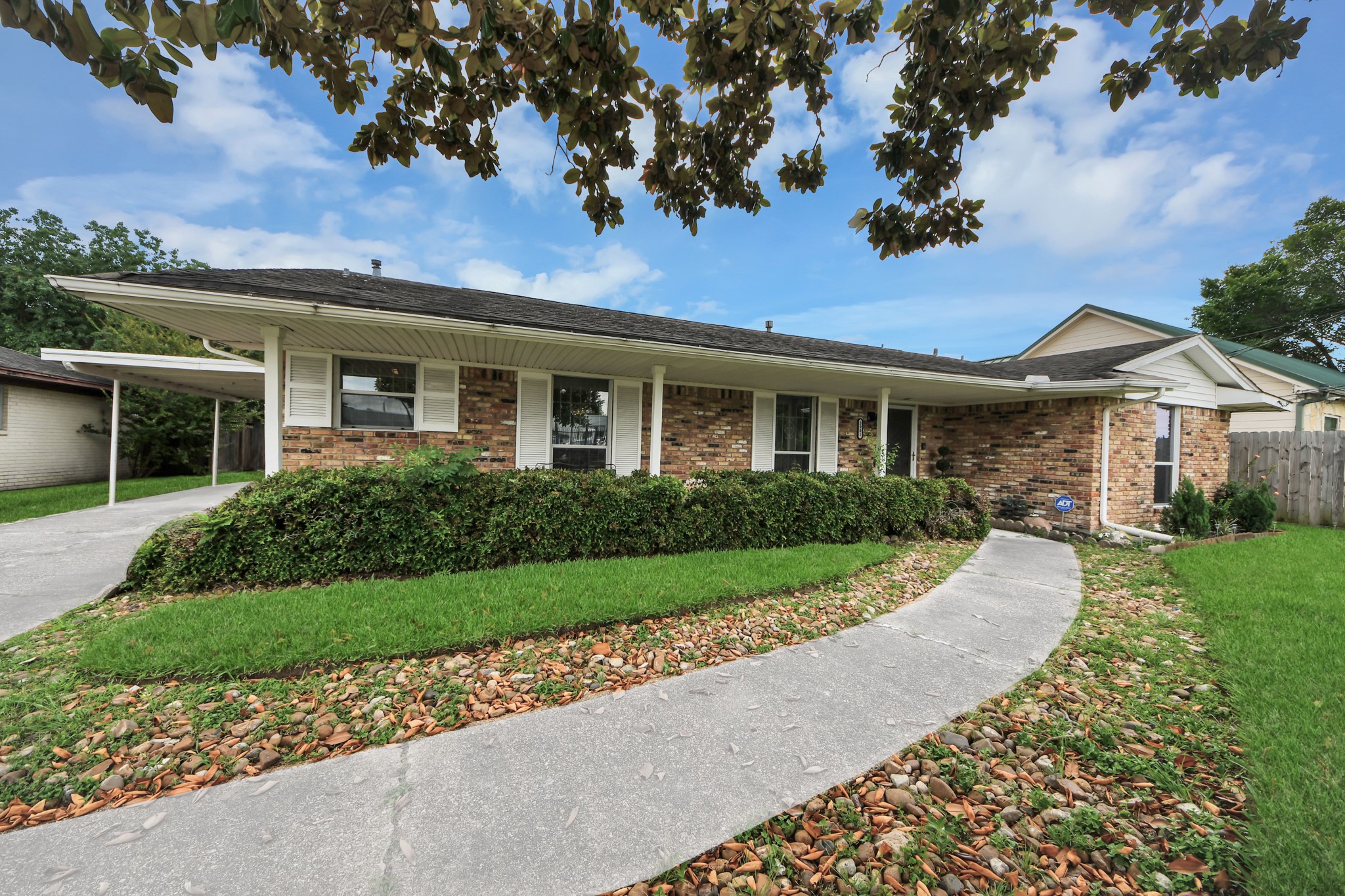 3901 Jeanetta Street Houston, TX 77063 - Photo 5 of 41 Inviting curb appeal with lush lawn, mature landscaping, extended walkway and covered parking.
