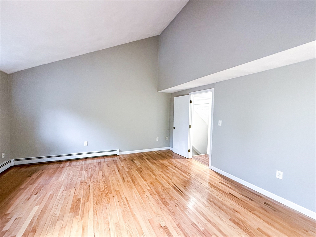 24 Wilson Street, Unit 4 Marlborough, MA 01752 - Photo 16 of 29 a view of an empty room and wooden floor