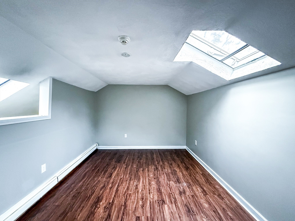 24 Wilson Street, Unit 4 Marlborough, MA 01752 - Photo 20 of 29 a view of empty room with wooden floor