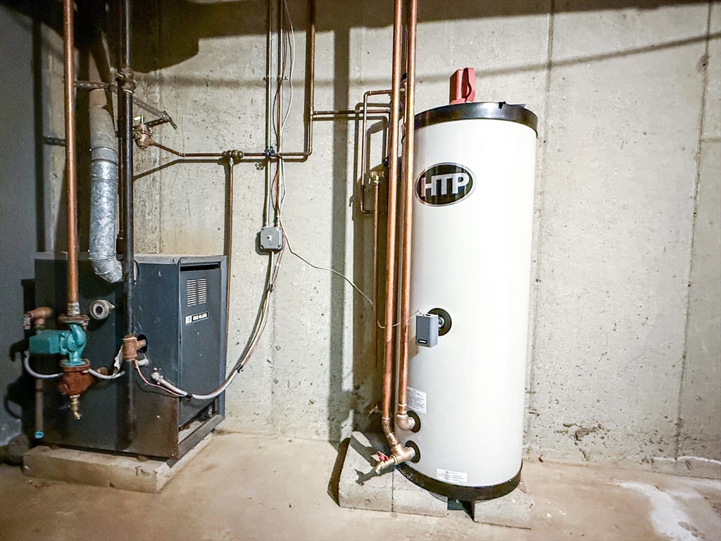24 Wilson Street, Unit 4 Marlborough, MA 01752 - Photo 28 of 29 a bathroom with a tub and a shower