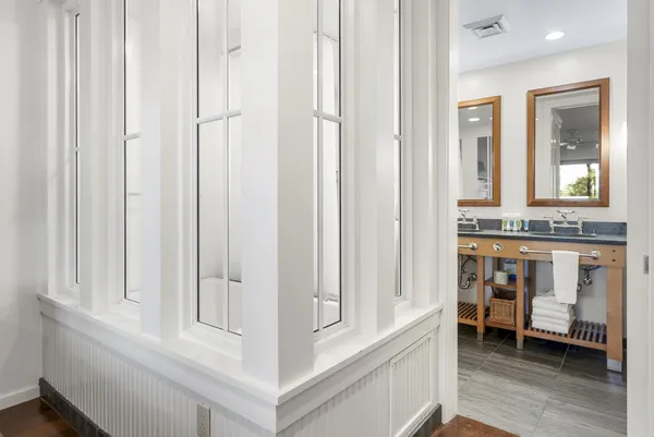 a view of an entryway with wooden floor