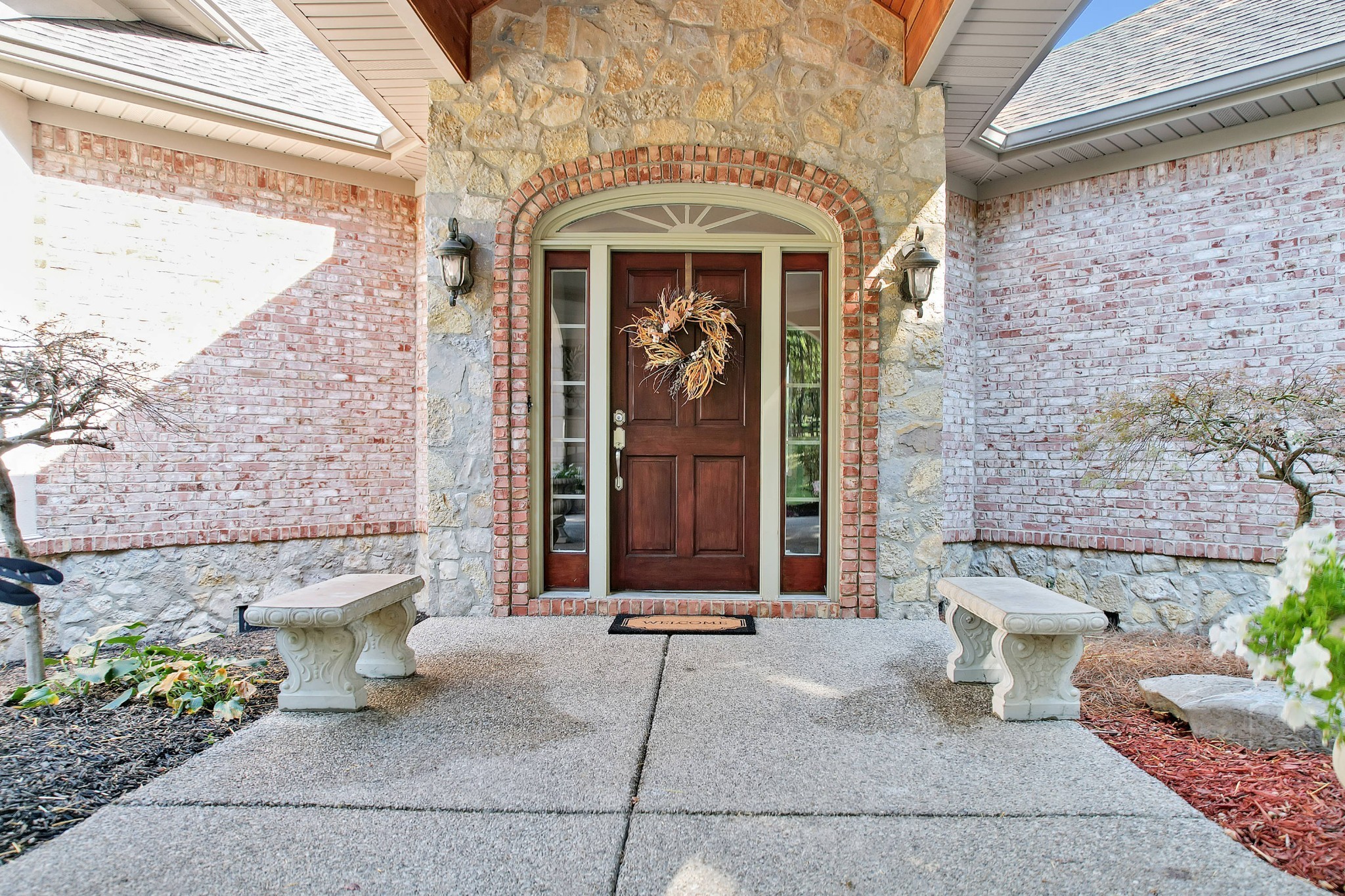 1745 Mann Road Lebanon, TN 37087 - Photo 5 of 47 a front view of a house with a floor to ceiling windows and potted plants