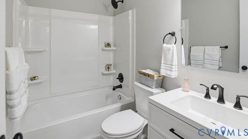 25209 Ritchie Avenue Petersburg, VA 23803 - Photo 34 of 50 a bathroom with a sink toilet and shower