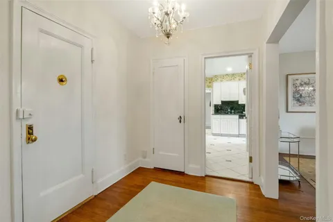 a view of an empty room and wooden floor