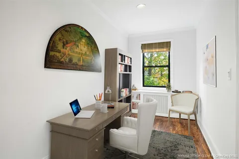 a bath room with a table and a window