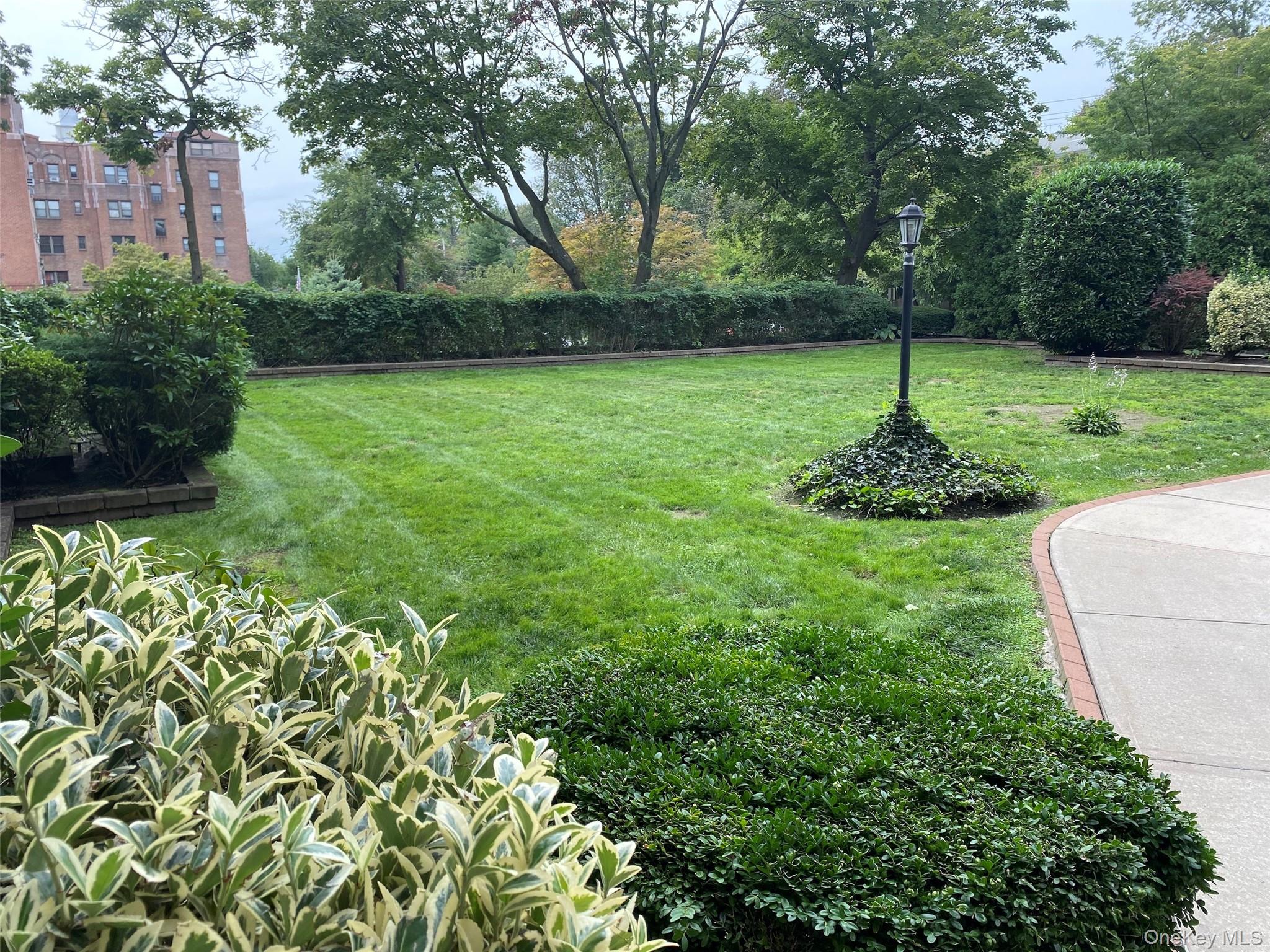 4810 Boston Post Road, Unit 2D Pelham, NY 10803 - Photo 26 of 30 a view of a backyard with a fountain