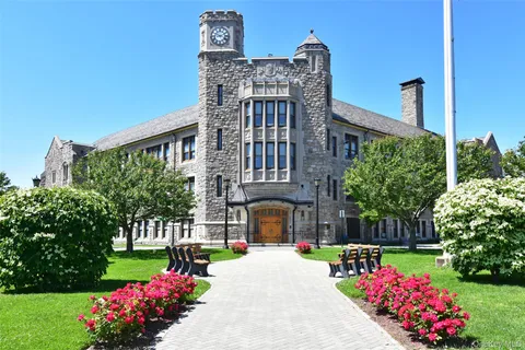 a front view of building with yard