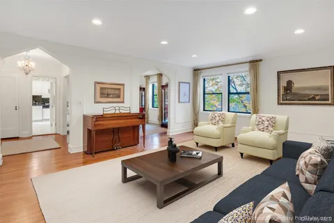 a living room with furniture rug and window