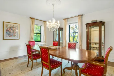 a view of a dining room with furniture and window