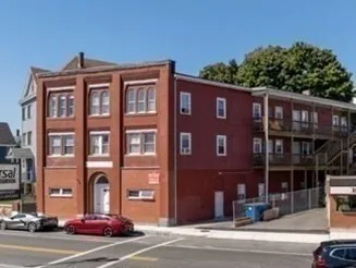 a front view of a building with street view