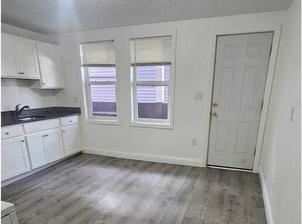 a view of cabinets and window