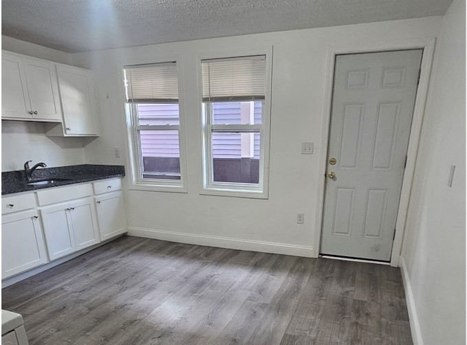 176 Ferry Street, Unit 3L Everett, MA 02149 - Photo 4 of 13 a view of cabinets and window