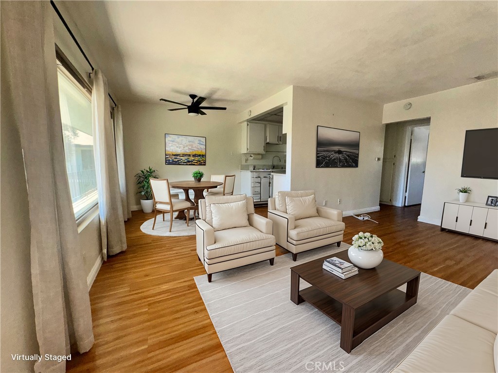 1330 West Lambert Road, Unit 132 La Habra, CA 90631 - Photo 1 of 1 a living room with furniture fireplace and a flat screen tv