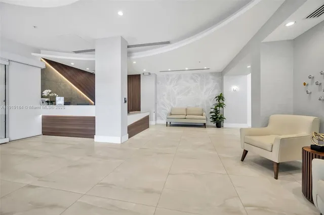 a view of kitchen with furniture and windows