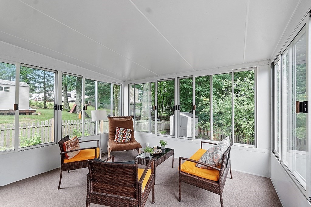 3 Neel Road Worcester, MA 01605 - Photo 13 of 41 a living room with furniture and a floor to ceiling window